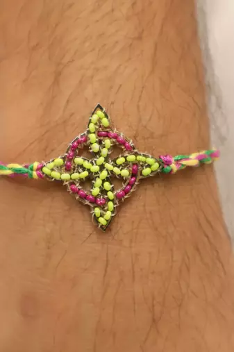 multicolor floral handcrafted beaded thread rakhi with roli chawal capsules
