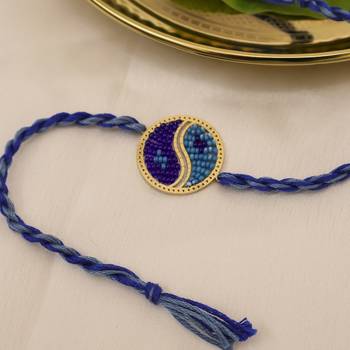 blue yin yang dual tone braided thread rakhi with roli chawal capsules 3