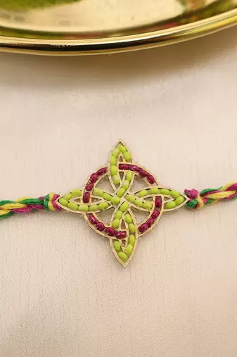 multicolor floral handcrafted beaded thread rakhi with roli chawal capsules