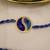 blue yin yang dual tone braided thread rakhi with roli chawal capsules