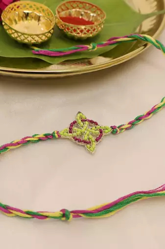 multicolor floral handcrafted beaded thread rakhi with roli chawal capsules