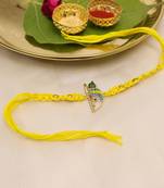 yellow krishna face beaded designer thread rakhi with roli chawal capsules