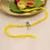 yellow krishna face beaded designer thread rakhi with roli chawal capsules