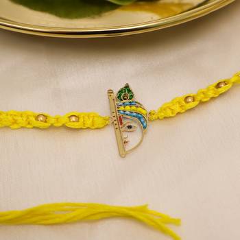 yellow krishna face beaded designer thread rakhi with roli chawal capsules 3