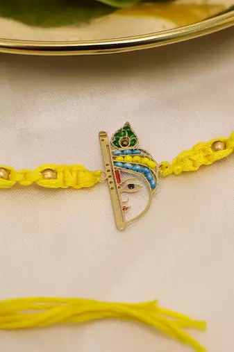 yellow krishna face beaded designer thread rakhi with roli chawal capsules