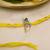 yellow krishna face beaded designer thread rakhi with roli chawal capsules
