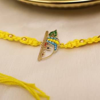 yellow krishna face beaded designer thread rakhi with roli chawal capsules 4