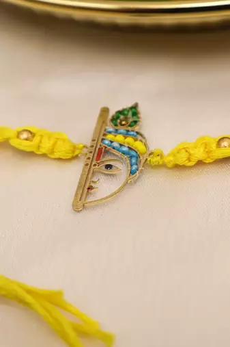 yellow krishna face beaded designer thread rakhi with roli chawal capsules