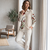 Women cream embroidered shirt and trousers co-ord set