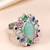 Oxidized silver plated faux emerald & multicolor crystals studded statement finger ring