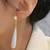 Gold plated pearl studded fancy drop earrings contemporary fashion jewellery for women & girls