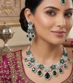 emerald green bridal jewellery set  silver toned necklace, chandelier earrings, maang tikka