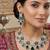 emerald green bridal jewellery set  silver toned necklace, chandelier earrings, maang tikka