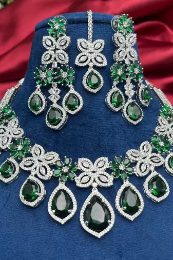 emerald green bridal jewellery set â€“ silver toned necklace, chandelier earrings, maang tikka