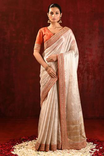 Light gold orange embroidered tissue saree set
