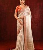 Light gold orange embroidered tissue saree set