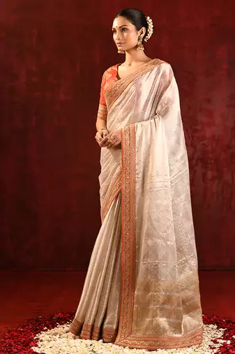 Light gold orange embroidered tissue saree set