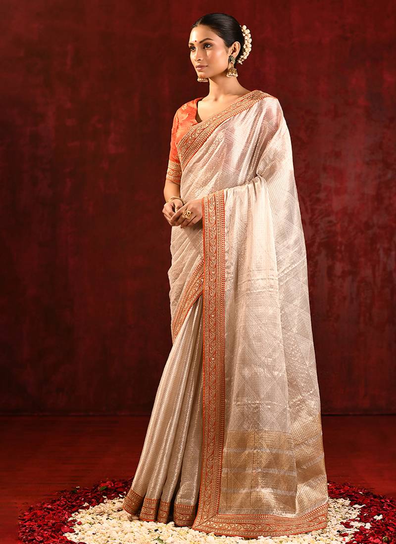 Light gold orange embroidered tissue saree set