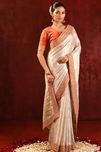 Light gold orange embroidered tissue saree set