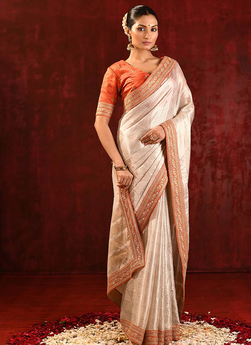Light gold orange embroidered tissue saree set