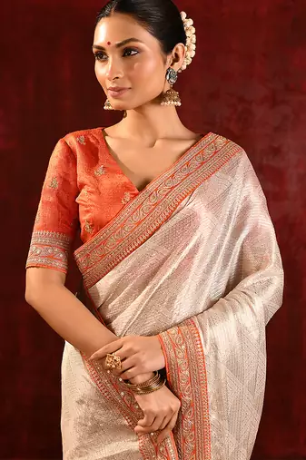 Light gold orange embroidered tissue saree set