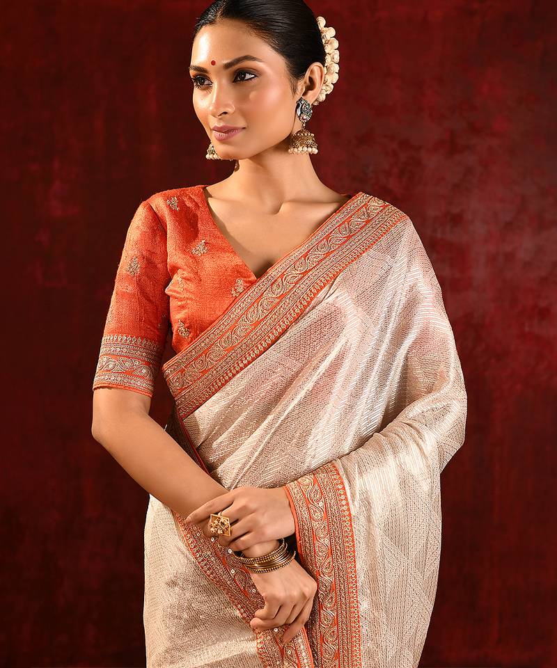 Light gold orange embroidered tissue saree set