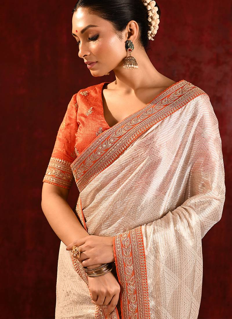 Light gold orange embroidered tissue saree set