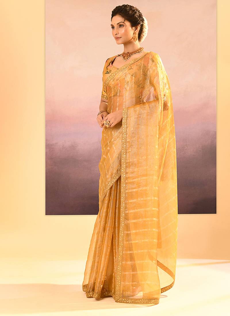 Golden yellow embroidered tissue saree set