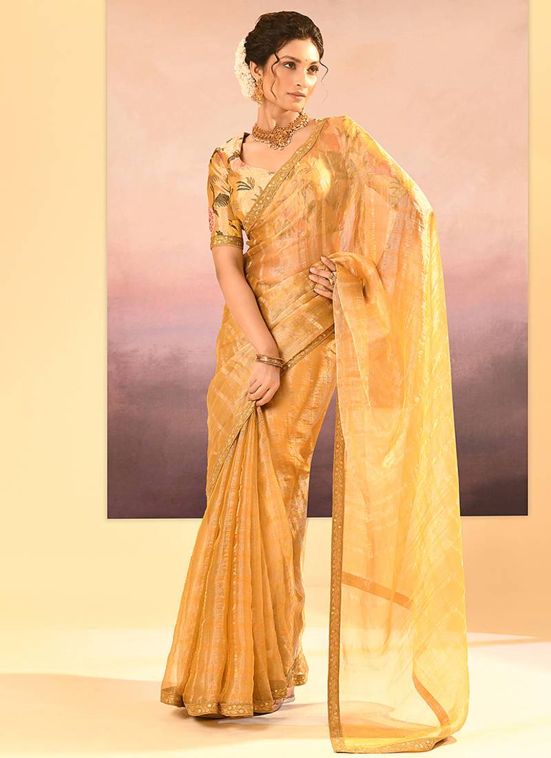 Golden yellow embroidered tissue saree set