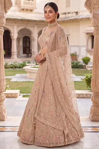 Elegant Floral Patterned Net Lehenga Set in Beige with Embellished Blouse and Dupatta with light gold colour.