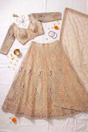 Elegant Floral Patterned Net Lehenga Set in Beige with Embellished Blouse and Dupatta with light gold colour.