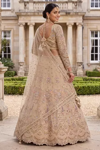 Light skin colour Beige Embroidered Bridal Lehenga Choli with Pastel Floral Motifs and Detailed Zardosi Work