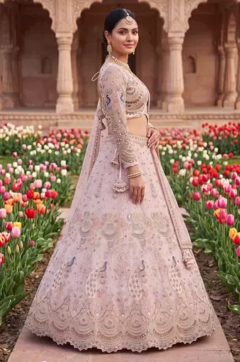 Designer Embroidered Pastel Pink Lehenga Choli Set with Peacock Motif and Net Dupatta for Wedding and Festive Wear