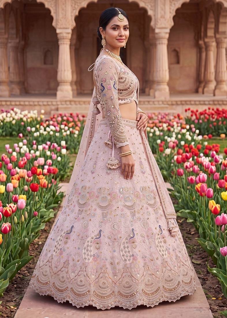 Designer Embroidered Pastel Pink Lehenga Choli Set with Peacock Motif and Net Dupatta for Wedding and Festive Wear