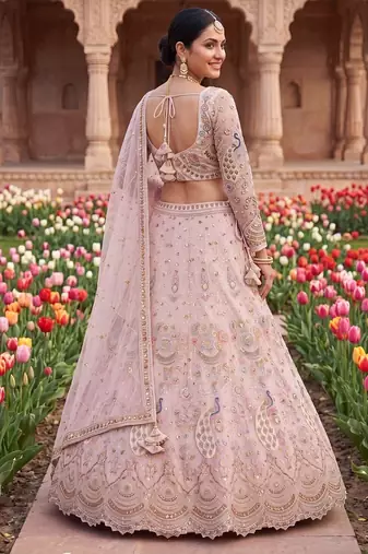 Designer Embroidered Pastel Pink Lehenga Choli Set with Peacock Motif and Net Dupatta for Wedding and Festive Wear