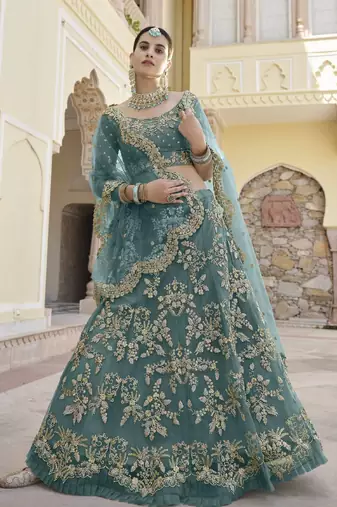 Turquoise sequins and dori embroidered soft net festive & party wear stitched lehenga