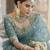 Turquoise sequins and dori embroidered soft net festive & party wear stitched lehenga