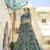 Turquoise sequins and dori embroidered soft net festive & party wear stitched lehenga