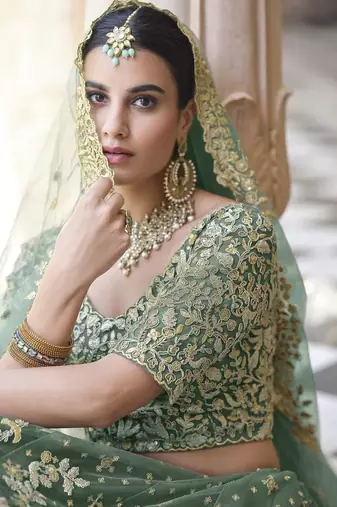 Light green sequins and dori embroidered soft net festive & party wear stitched lehenga choli