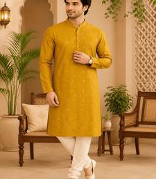 Yellow ethnic printed kurta with cream churidar set