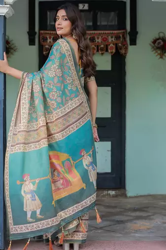 Graceful teal blue handloom saree with floral heritage art with blouse