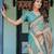Graceful teal blue handloom saree with floral heritage art with blouse