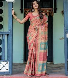 Elegant coral pink handloom saree with traditional peacock motifs with blouse