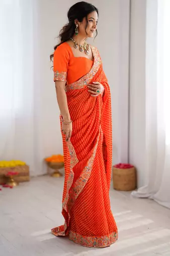 Orange embroidered bandhani print faux georgette saree with unstitched mono benglori silk blouse