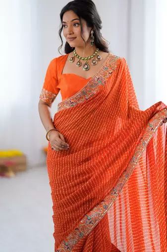 Orange embroidered bandhani print faux georgette saree with unstitched mono benglori silk blouse