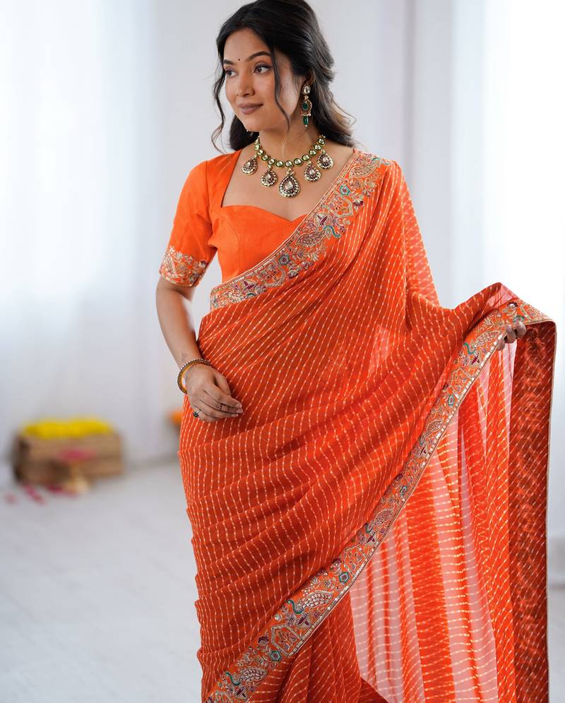 Orange embroidered bandhani print faux georgette saree with unstitched mono benglori silk blouse