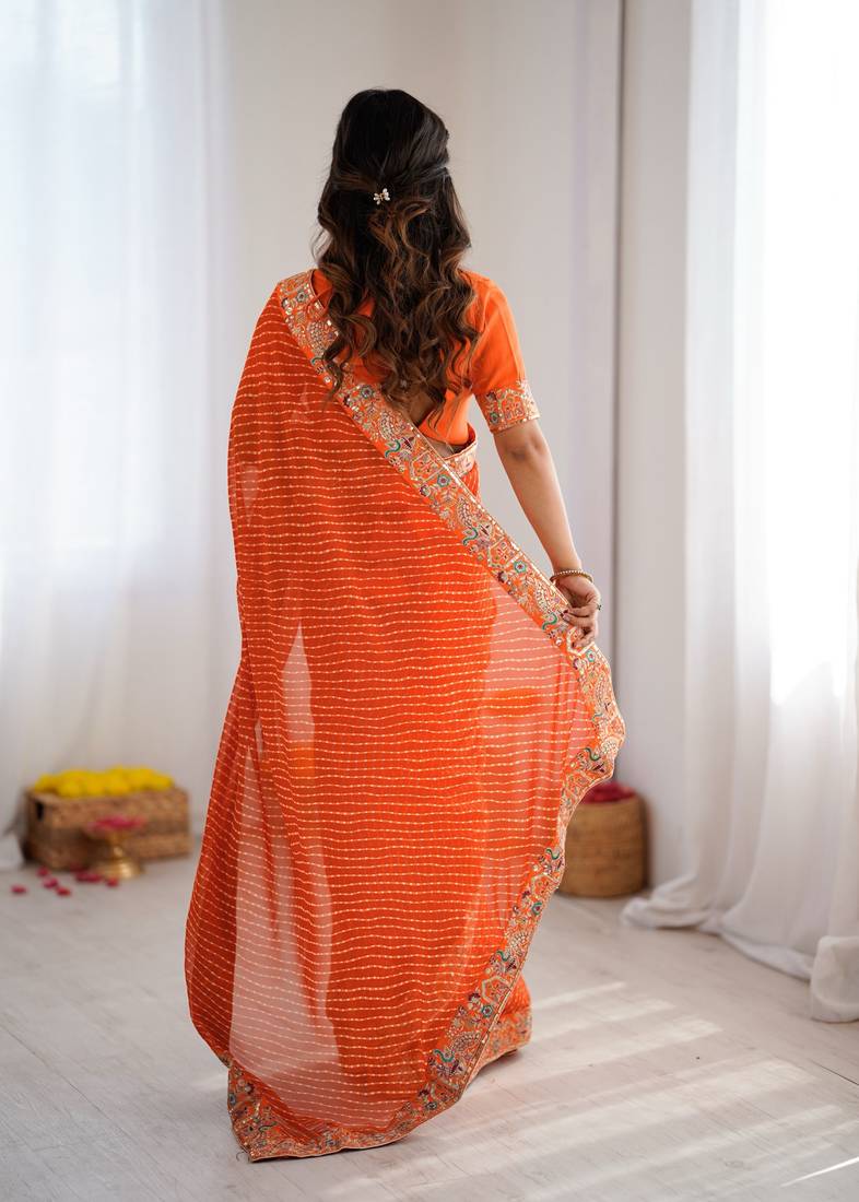 Orange embroidered bandhani print faux georgette saree with unstitched mono benglori silk blouse