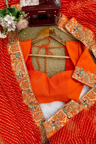 Orange embroidered bandhani print faux georgette saree with unstitched mono benglori silk blouse