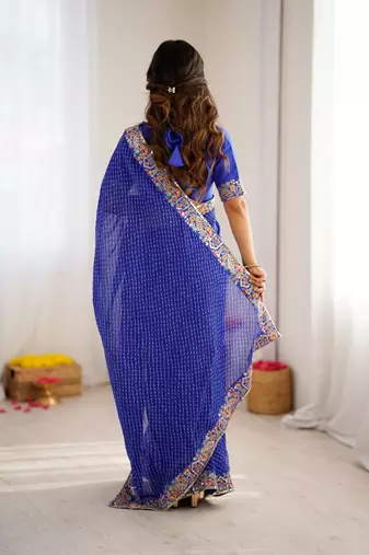 Royal blue thread & sequins embroidered faux georgette bandhani print saree with unstitched blouse