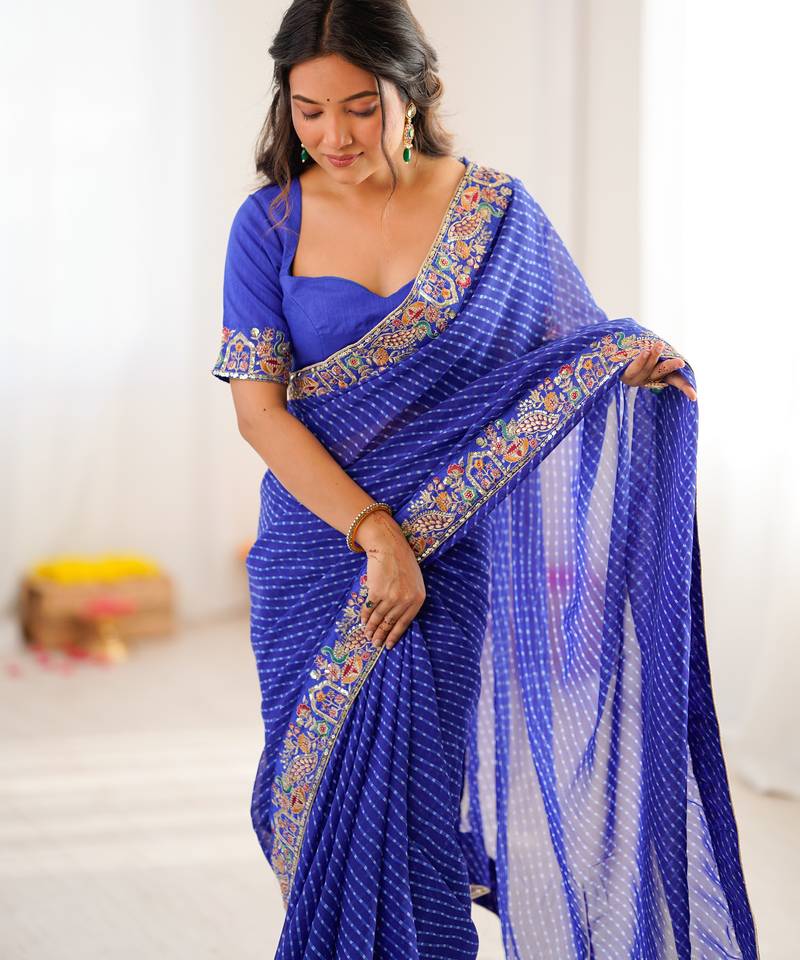 Royal blue thread & sequins embroidered faux georgette bandhani print saree with unstitched blouse